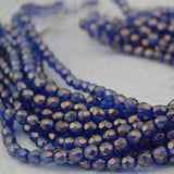 HALO ULTRAMARINE 4mm Faceted Round Czech Glass Beads / Fire Polished Qty 50 Transparent Dark Sapphire Blue Gold Halo Firepolished